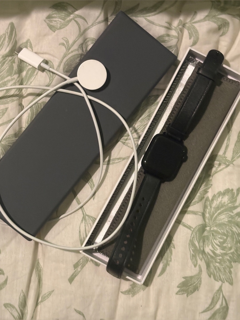Black Smartwatch with Leather Band and Magnetic Charger